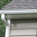 Marc’s on the Glass hand washing gutters with black stain and stripes in Richmond, VA - restoration